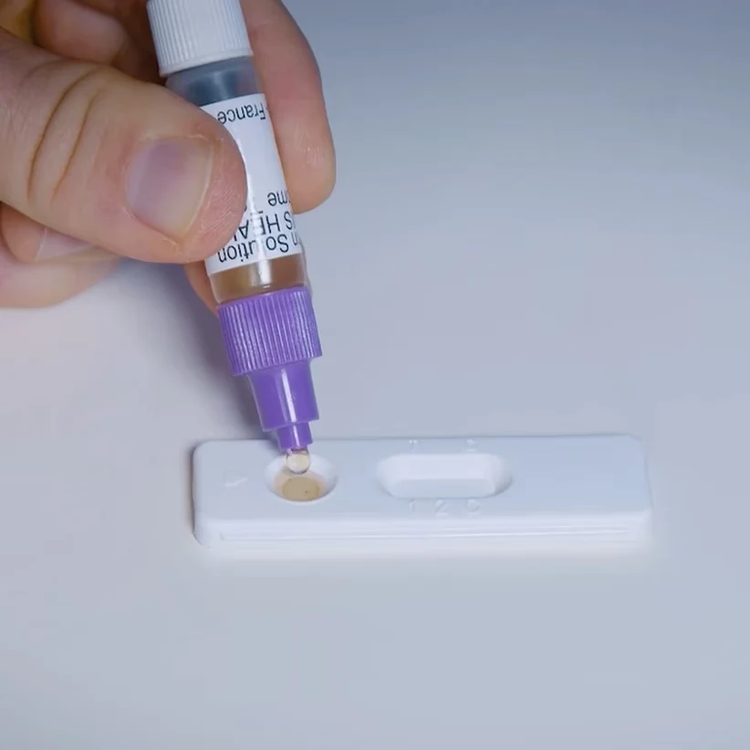 Patris Health Calprotectin Home Test – step 3, adding drops of the extract into the sample well of the test device