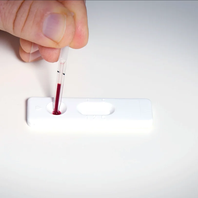 Patris Health Thyroid Function Home Test – step 3, releasing the blood from the pipette into the sample well